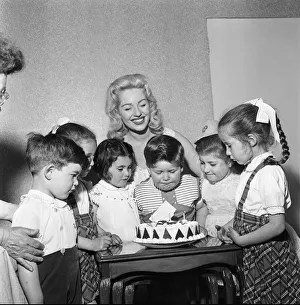 Birthday Cake Prints: Sheree Winton, her son Dale Winton (centre looking over his cake)