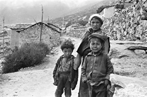 Sherpa children pose in the street of one of the high villages in the SoluKhumbu region