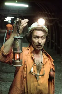 Miners Prints: The last shift at Cotgrave Colliery, one of the last miners underground holds a Davy lamp