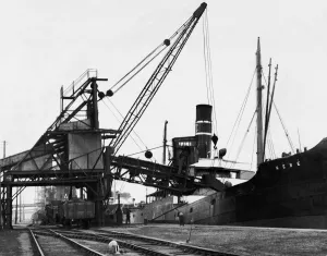Dockyard Prints: A ship loading anthracite coal by conveyor at the Swansea docks. Circa January 1937