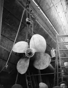 Shipbuilders at the King George V dry dock in Southampton replace one of the mighty