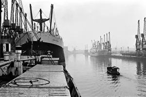 Cranes Prints: Ships unloading in the docks at Manchester seen through the mist May 1967