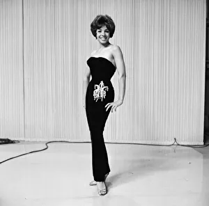 Shirley Bassey wearing the hip-hugging black velvet dress that she says catches mens