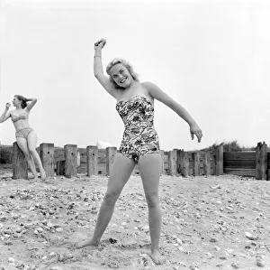 Shirley Eaton and Shirley Burniston seen here modelling a bikini and all in one Swim suit