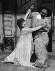 Cowboy Prints: Shirley Kellogg and Harry Tate on stage at the Hippodrome during a performance of