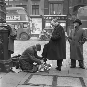 Men Only Prints: Shoe shine at work in Whitechapel High Street in the east end of London