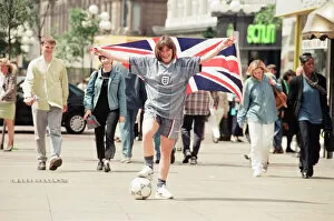 Images Dated 25th June 1996: Shop asistant Karen Burke from Soccer City, models Englands Grey Strip, Liverpool