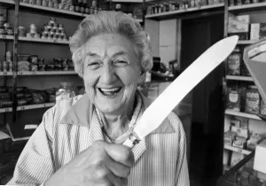 Shopkeeper Dorothy Gleave holding a knife that she used to chase away two armed teengaers