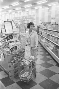 Supermarket Prints: Shopper browsing the aisles at a newly opened self service food store in North London