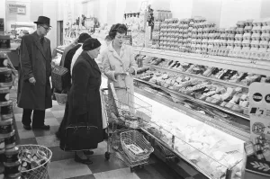 Dairy Prints: Shoppers browsing the dairy counter at a newly opened self service food store in North
