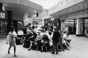 Shoppers sit, relax and chat at the Salford City Shopping Centre. June 1972