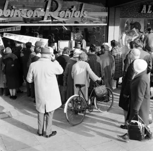 00850 Prints: Shoppers watch Sir Winston Churchill state funeral through shop window of Robinson