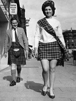 00117 Prints: Shorty'kilts for export. Olive Lennen braves the looks from a highland gentleman as