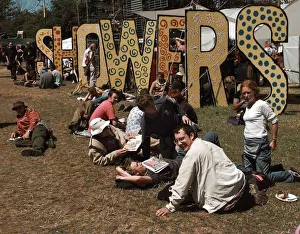 Shower Prints: The showers at the Glastonbury Festival 1999 as fans relax in the sunshine