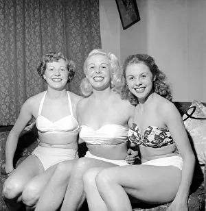 Three showgirls limber up in their digs before a performance. 1959 E09-004