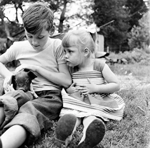00473 Prints: Siblings, Helen (3) and Paul Burrows (9) from Waterloo, London