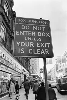 00109 Prints: Sign warning drivers of a box junction ahead in rin Oxford Street London