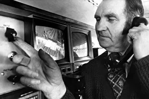 Buttons Prints: Signal man Walter Allan opening the level crossing at Clifton with the push of a button