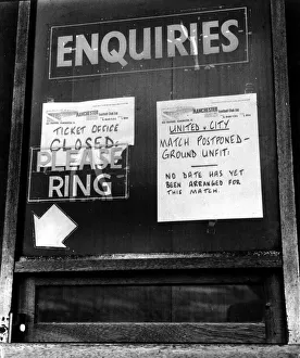 Signs at Manchester United ticket office informing fans of the postponement of their