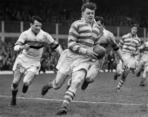 00036 Prints: Silcock of Wigan bursts through beating several Bradford players to score a fine try in
