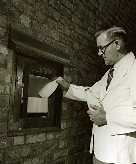 00006 Prints: The Silent Butler - 1948 compartment built into structure to house milk delivery