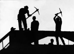 A silhouette of four demolition workers perched high above Newgate Street