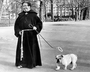 Monk Prints: Simon the Bulldog - a little saint with his golden halo above his head - with his owner