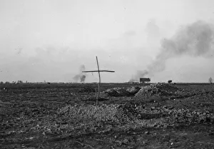 A simple cross marks the spot of a grave of a Belgian soldier killed during the fighting