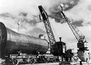 00411 Prints: The Singapore Naval base showing vessels refitting or in dock during the Second World War
