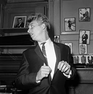 Suit Prints: Singer and Actor Tommy Steele tries on his wedding suit. 1960