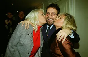 Facial Hair Prints: Singer Cliff Richard receives a kss on the cheek from Eastenders actress Wendy Richard