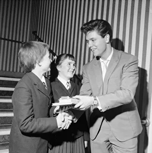 Prize Prints: Singer Cliff Richard seen here presenting a school prize of three books to Carol