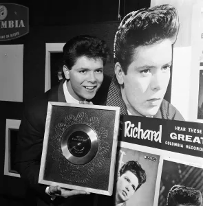 Disc Prints: Singer Cliff Richard with his Silver Disc award for the single I Love You