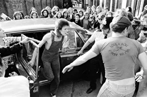 Cigarette Prints: Singer David Bowie as Ziggy Stardust arrives at the stage door of the Odeon in