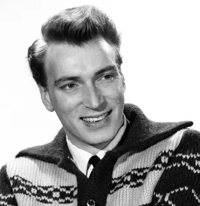 Singer Frank Ifield seen here posing for the Reveille newspaper for a fashion feature
