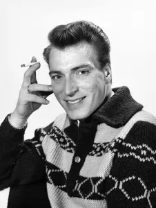 Singer Frank Ifield seen here posing for the Reveille newspaper for a fashion feature