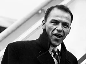 Singer Frank Sinatra about to board a TWA flight to New York at London Airport
