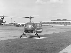 00303 Prints: Singer Frank Sinatra seen here arriving at Heathrow Airport by helicopter