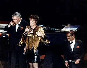Singer Frank Sinatra on stage with Liza Minnelli and Sammy Davis Jnr performing on stage