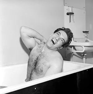 Singer Frankie Vaughan seen here singing in the bath at the family home. Circa 1957