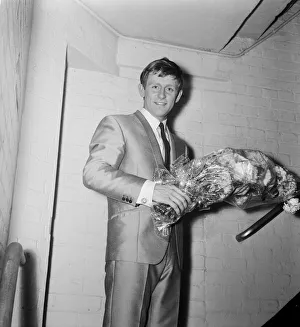 Stairwell Prints: Singer Johnny Leyton holding a bunch of flowers backstage after giving a concert to
