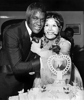 Singer Lovelace Watkin seen embracing his new bride Anna Maria Fitzsimmons who is