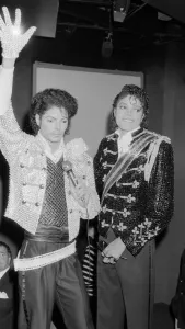 Soul Prints: Singer Michael Jackson looking at a waxwork model of himself on display at madame