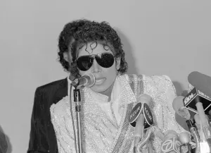 Microphones Prints: Singer Michael Jackson speaks at a press conference before performing in concert in