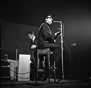 Microphones Prints: Singer and musician Roy Orbison performing on stage at the De Montfort Hall in April