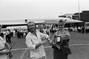 Plane Prints: Singer Phil Collins & wife Jill Travelman at London Heathrow Airport