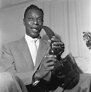 Singer and pipe collector Nat King Cole seen here with his Bristol glass pipe which is