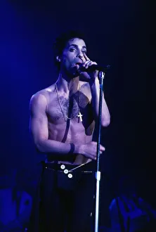 Singer Prince August 1986 on stage bare chested singing into microphone at Wembley