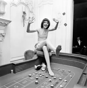 Singer Sandie Shaw has a flutter at a party she gave for shoe-retailers attending