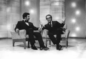 Singer Tom Jones with Actor Peter Sellers on a chat show - Sellers gestures with his